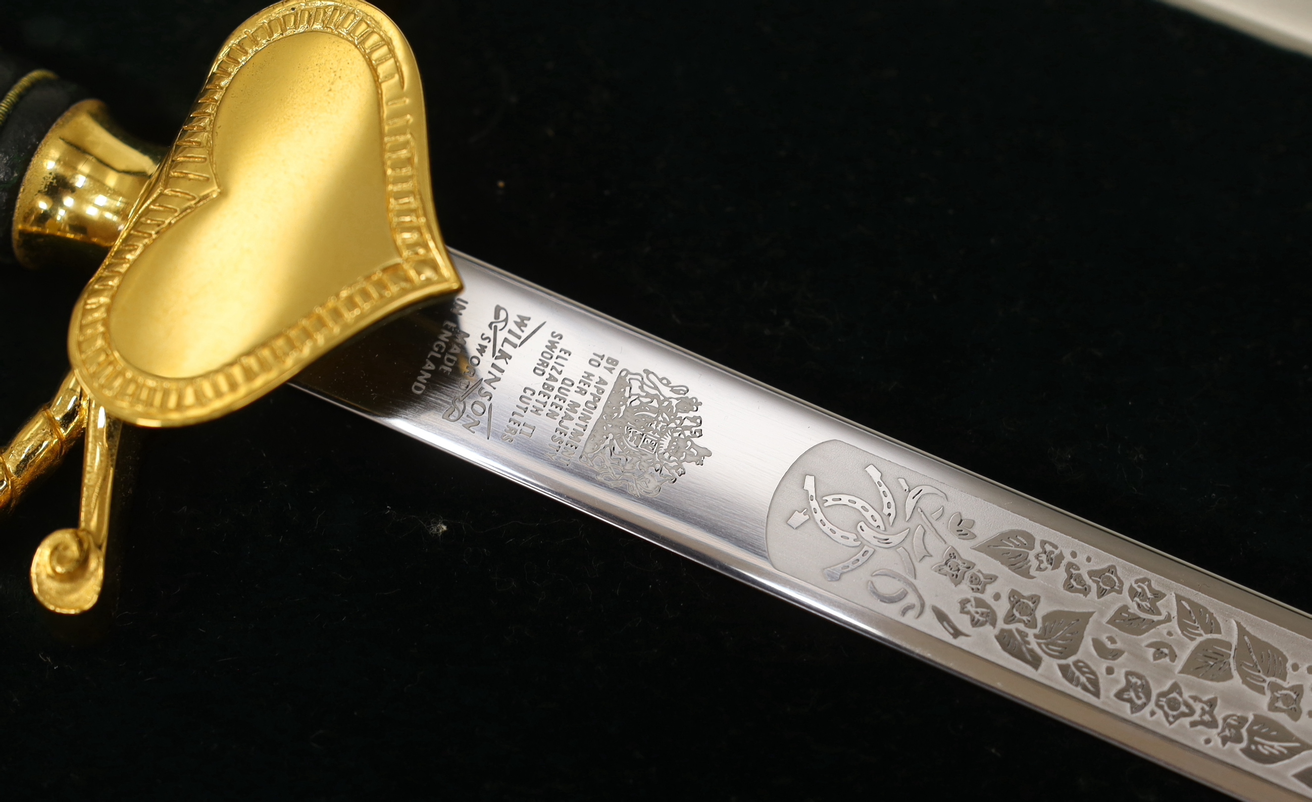 A Wilkinson presentation sword with etched blade, in Harrods case, blade 60cm